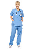 Cheerful relaxed female doctor in uniform