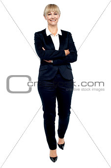 Gorgeous woman in business suit walking towards you