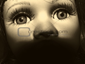 the face of toy doll. sepia