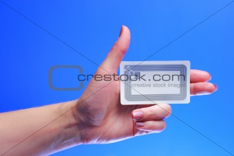 woman hand holding RFID tag