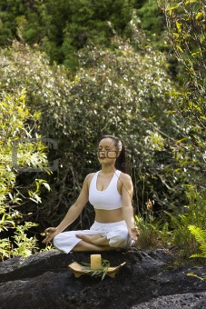 Asian woman meditating.