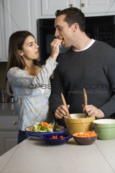 Couple in kitchen.