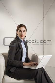 Woman working on laptop.