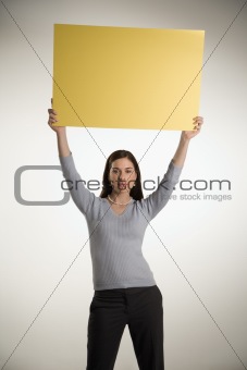 Woman holding blank sign.