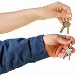 Man and Woman handing over house keys.