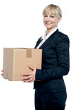 Corporate woman with a cardboard box in hand