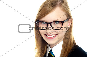 Closeup shot of smiling schoolgirl in eyeglasses