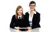 Tutor and student duo operating tablet pc