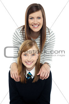 Cheerful duo of adorable mother and daughter