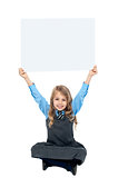 Sweet kid holding blank ad board above her head