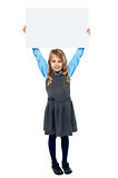 Kid holding blank billboard above her head