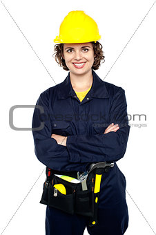 Confident female worker posing with arms crossed