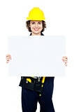 Female worker holding blank whiteboard
