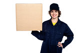 Delivery woman balancing a sealed carton