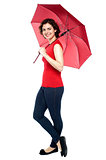 Casual shot of a trendy woman with an umbrella
