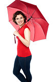 Beautiful woman holding a red umbrella