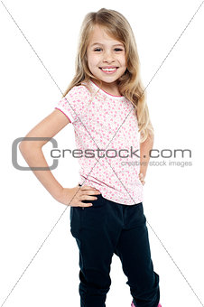 Cheerful girl child with hands on waist
