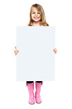 An adorable kid showing blank whiteboard