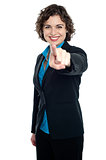 Joyous corporate woman pointing you out