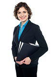 Attractive corporate lady with files in hand