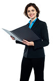 Businesswoman reviewing company documents