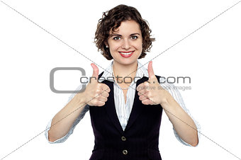 Pretty lady gesturing double thumbs up