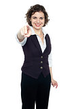 Woman in formals pointing forward