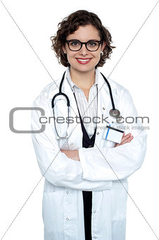 Bespectacled lady doctor posing confidently