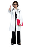 Lady surgeon gesturing thumbs up