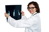 Female doctor reviewing x-ray sheet of a patient
