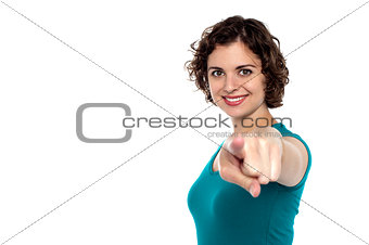Fashion young woman pointing at you