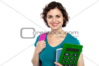 Female student holding education accessories