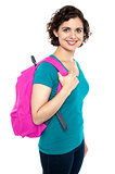 Beautiful female student with pink backpack
