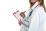 Cropped image of doctor writing on clipboard