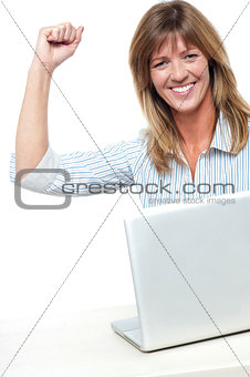 Excited businesswoman celebrating her success