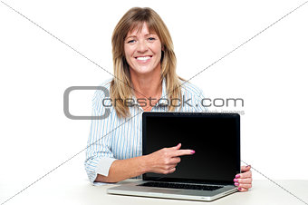 Female representative presenting new laptop