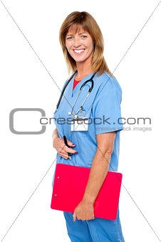 Smiling medical nurse with clipboard