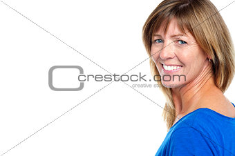 Cheerful middle aged blonde with copy space