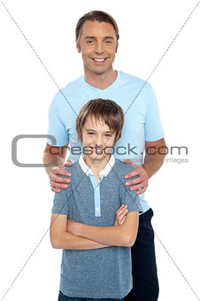 Middle aged father posing with his smart son