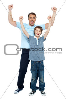 Father and son celebrating their success