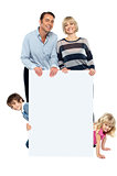 Lively family of four all around blank whiteboard