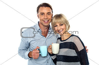 Couple starting their day with a cup of coffee