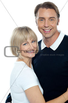 Adorable cheerful wife embracing her husband