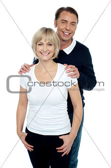 Portrait of trendy couple striking stylish pose