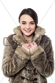Stylish young girl in fur jacket