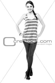 Pretty young girl striking a stylish pose