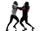 two american football players on scrimmage holding silhouette