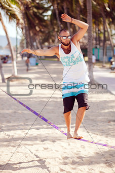 man balancing on the rope
