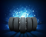 Wedge of new car wheels. Abstract blue background