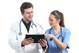 Doctor and nurse student working with a tablet